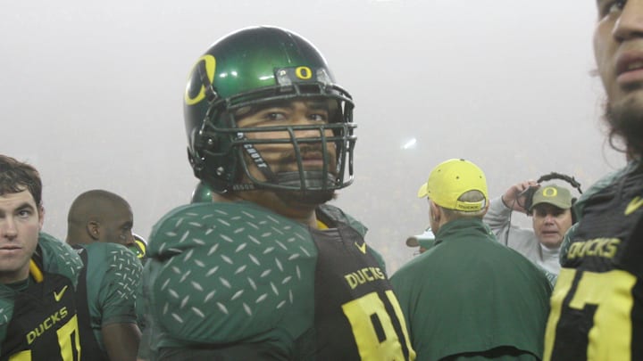 -

-Haloti Ngata is flanked by teammates at the Civil War Game Saturday, November 19, 2005. (Thomas Patterson/Statesman Journal)

Haloti Ngata was Oregon's top recruit in the 2002 recruiting class.

No Title