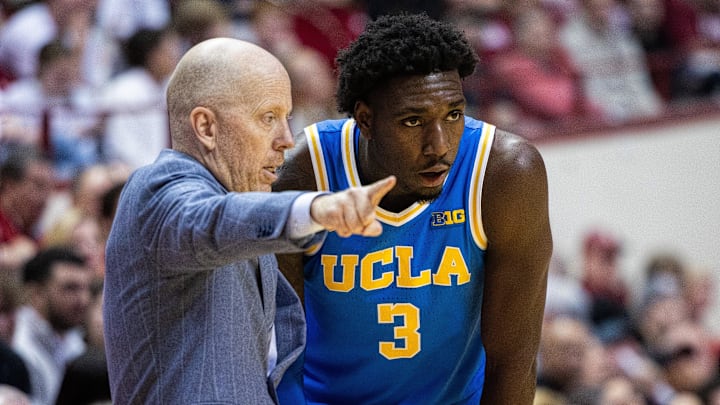 Feb 14, 2025; Bloomington, Indiana, USA; UCLA Bruins head coach Mick Cronin talks to guard Eric Dailey Jr. (3) in the second half against the Indiana Hoosiers at Simon Skjodt Assembly Hall. Mandatory Credit: Trevor Ruszkowski-Imagn Images