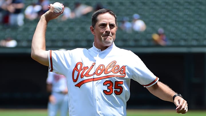 Jun 30, 2019; Baltimore, MD, USA; Former Baltimore Orioles pitcher Mike Mussina (35) throws out the first pitch prior to the game against the Cleveland Indians at Oriole Park at Camden Yards. Mandatory Credit: Evan Habeeb-Imagn Images