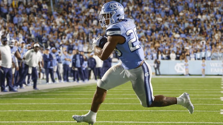 Oct 14, 2023; Chapel Hill, North Carolina, USA; North Carolina Tar Heels running back Omarion Hampton (28) runs for a second-half touchdown against the Miami Hurricanes at Kenan Memorial Stadium. Oct 14, 2023; Chapel Hill, North Carolina, USA; North Carolina Tar Heels running back Omarion Hampton (28) runs for a second-half touchdown against the Miami Hurricanes at Kenan Memorial Stadium.