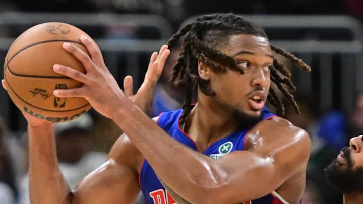 Oct 9, 2025; Milwaukee, Wisconsin, USA;  Detroit Pistons guard Chaz Lanier (20) gets pressure from Milwaukee Bucks guard Gary Trent Jr. (5) in the second quarter at Fiserv Forum. Mandatory Credit: Benny Sieu-Imagn Images