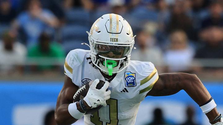 Dec 27, 2025; Orlando, FL, USA; Georgia Tech Yellow Jackets wide receiver Dean Patterson (11) runs with the ball against the BYU Cougars  during the first half at Camping World Stadium. Mandatory Credit: Kim Klement Neitzel-Imagn Images