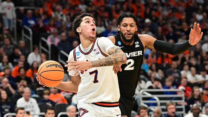 Mar 21, 2025; Milwaukee, WI, USA: Illinois Fighting Illini forward Will Riley (7) drives to the hoop past Xavier Musketeers forward Jerome Hunter (2) during the second half at Fiserv Forum. Mandatory Credit: Benny Sieu-Imagn Images