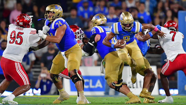 Aug 30, 2025; Pasadena, California, USA; UCLA Bruins quarterback Nico Iamaleava (9) runs the ball against the Utah Utes during the first half at Rose Bowl. Mandatory Credit: Gary A. Vasquez-Imagn Images