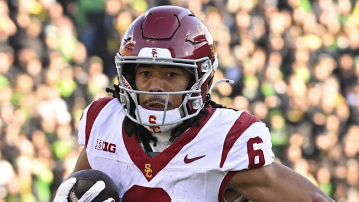 Nov 22, 2025; Eugene, Oregon, USA; Southern California Trojans wide receiver Makai Lemon (6) runs with the ball during the first half against the Oregon Ducks at Autzen Stadium. Mandatory Credit: Troy Wayrynen-Imagn Images Nov 22, 2025; Eugene, Oregon, USA; Southern California Trojans wide receiver Makai Lemon (6) runs with the ball during the first half against the Oregon Ducks at Autzen Stadium. Mandatory Credit: Troy Wayrynen-Imagn Images