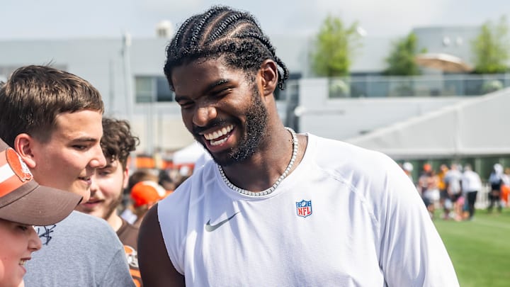 Jul 26, 2025; Berea, OH, USA; Cleveland Browns quarterback Shedeur Sanders (12) talks to a fan during training camp at CrossCountry Mortgage Campus. Mandatory Credit: Ken Blaze-Imagn Images