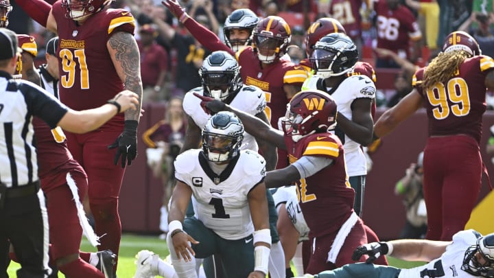 Oct 29, 2023; Landover, Maryland, USA; Philadelphia Eagles quarterback Jalen Hurts (1) reacts after fumbling against the Washington Commanders during the second half at FedExField. Mandatory Credit: Brad Mills-USA TODAY Sports Oct 29, 2023; Landover, Maryland, USA; Philadelphia Eagles quarterback Jalen Hurts (1) reacts after fumbling against the Washington Commanders during the second half at FedExField. Mandatory Credit: Brad Mills-USA TODAY Sports
