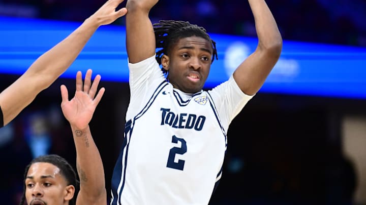 Mar 13, 2026; Cleveland, OH, USA; Toledo Rockets guard Leroy Blyden Jr. (2) looks to pass as Massachusetts Minutemen guard Danny Carbuccia (0) defends during the first half at Rocket Arena Mandatory Credit: Ken Blaze-Imagn Images
