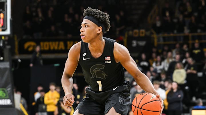 Mar 6, 2025; Iowa City, Iowa, USA; Michigan State Spartans guard Jeremy Fears Jr. (1) controls the ball as Iowa Hawkeyes guard Drew Thelwell (3) defends during the first half at Carver-Hawkeye Arena. Mandatory Credit: Jeffrey Becker-Imagn Images