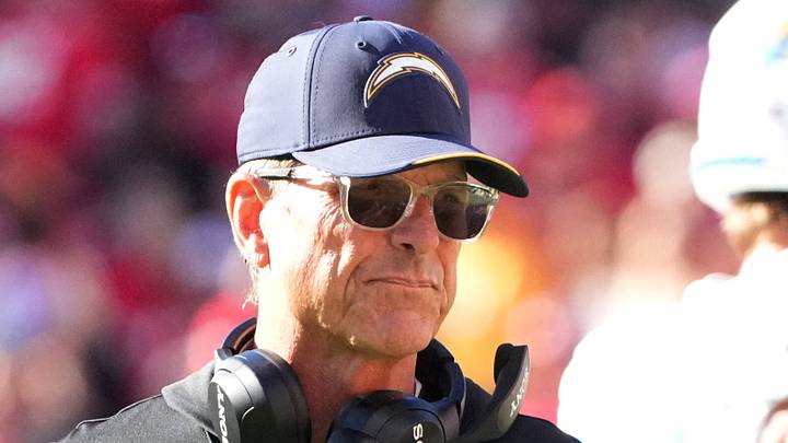 Los Angeles Chargers head coach Jim Harbaugh looks on during the first quarter against the Kansas City Chiefs; Denny Medley