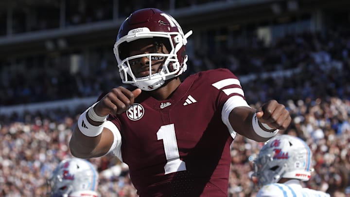 Mississippi State Bulldogs quarterback Kamario Taylor (1) celebrates after scoring a touchdown against the Mississippi Rebels in the first half at Davis Wade Stadium at Scott Field.