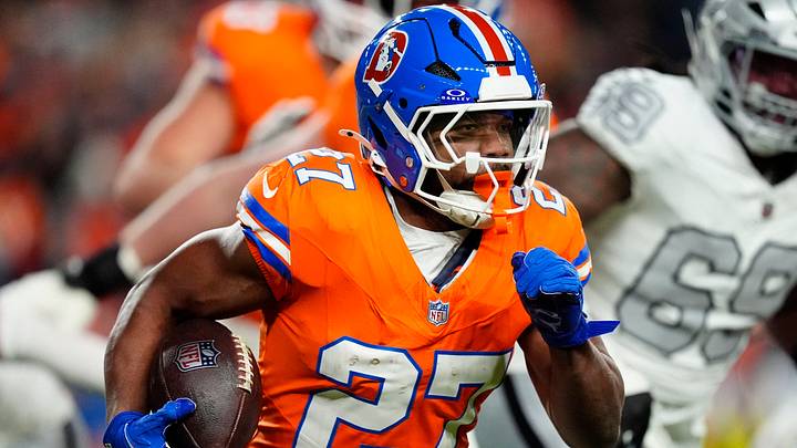 Nov 6, 2025; Denver, Colorado, USA; Denver Broncos running back J.K. Dobbins (27) rushes the ball against the Las Vegas Raiders during the first half at Empower Field at Mile High. Mandatory Credit: Ron Chenoy-Imagn Images