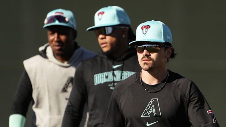 Arizona Diamondbacks' Corbin Carroll, Ketel Marte, and Geraldo Perdomo during spring training workouts at Salt River Fields at Talking Stick near Scottsdale on Feb. 19, 2024.