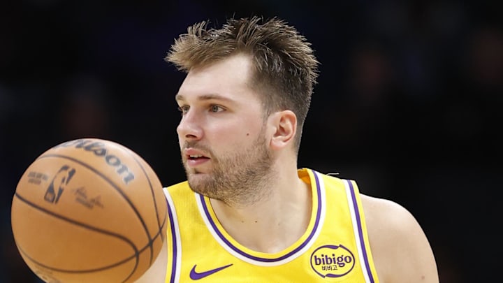 Nov 10, 2025; Charlotte, North Carolina, USA; Los Angeles Lakers forward/guard Luka Doncic (77) brings the ball up the court during the second quarter at Spectrum Center. Mandatory Credit: Brian Westerholt-Imagn Images