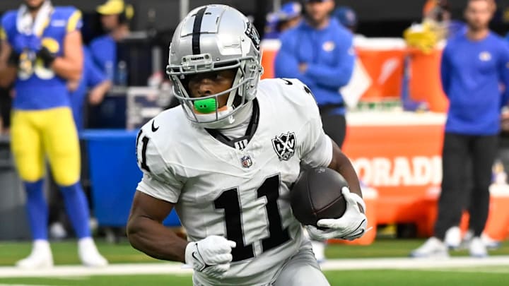 Oct 20, 2024; Inglewood, California, USA; Las Vegas Raiders wide receiver Tre Tucker (11) heads down the field after catching a short pass during the fourth quarter against the Los Angeles Rams at SoFi Stadium. Mandatory Credit: Robert Hanashiro-Imagn Images