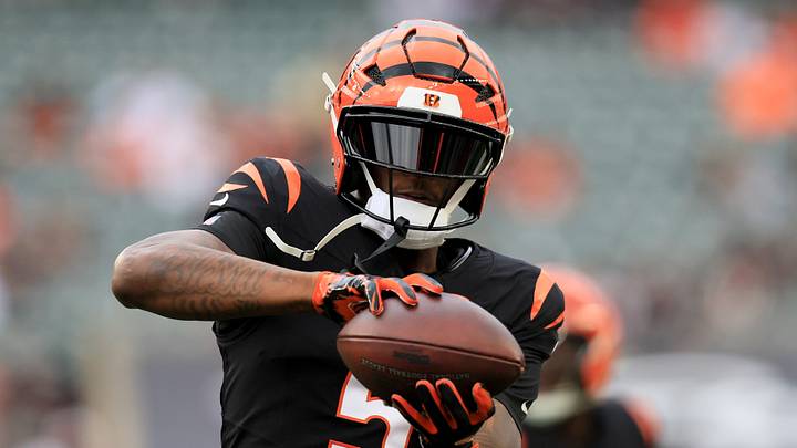 Cincinnati Bengals wide receiver Tee Higgins (5) warms up before a game against the Arizona Cardinals at Paycor Stadium. Cincinnati Bengals wide receiver Tee Higgins (5) warms up before a game against the Arizona Cardinals at Paycor Stadium.