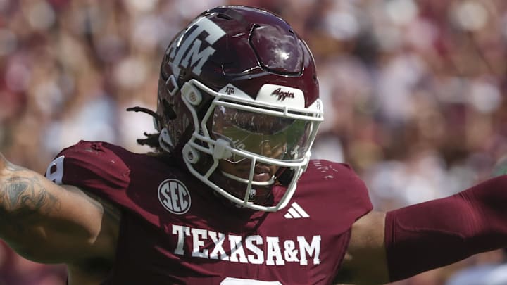Nov 15, 2025; College Station, Texas, USA; Texas A&M Aggies defensive end Cashius Howell (9) reacts after a defensive play during the first quarter against the South Carolina Gamecocks at Kyle Field. Mandatory Credit: Troy Taormina-Imagn Images