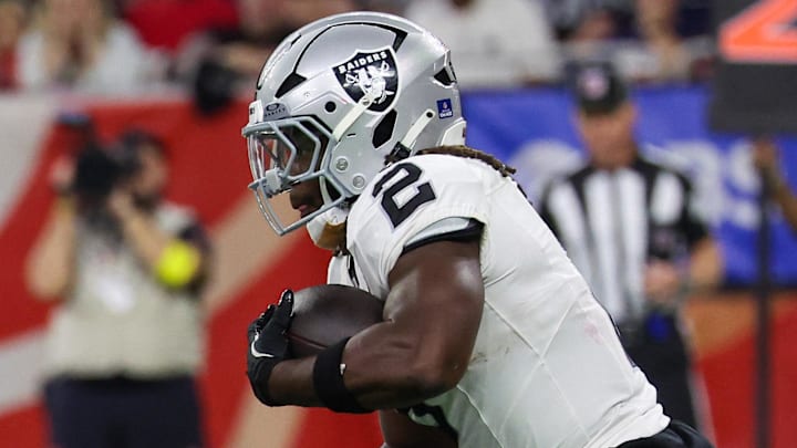 Dec 21, 2025; Houston, Texas, USA; Las Vegas Raiders running back Ashton Jeanty (2) rushes against the Houston Texans in the second half at NRG Stadium. Mandatory Credit: Thomas Shea-Imagn Images