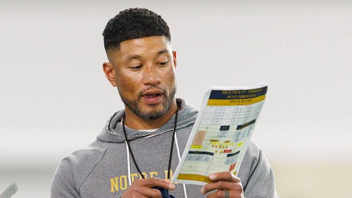 Head coach Marcus Freeman, right, speaks to a group of players during a Notre Dame football practice at Irish Athletic Center on Wednesday, April 8, 2026, in South Bend.