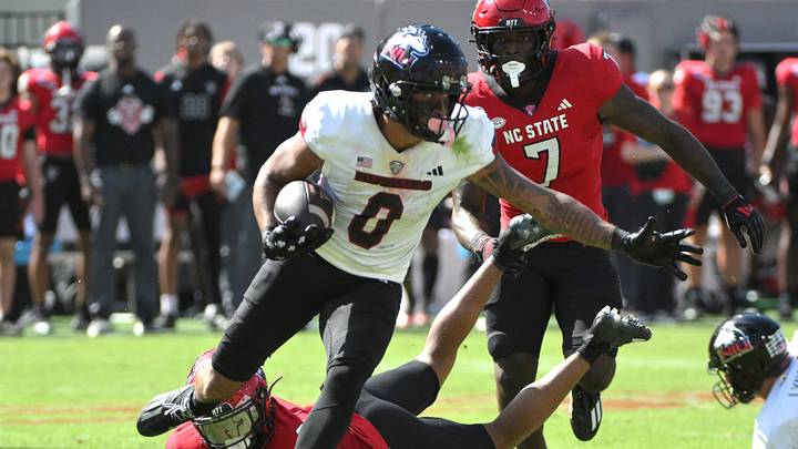 Sep 28, 2024; Raleigh, North Carolina, USA; Northern Illinois Huskies wide receiver Cam Thompson (0) eludes North Carolina State Wolfpack cornerback Brandon Cisse (2) at Carter-Finley Stadium. Mandatory Credit: Zachary Taft-Imagn Images Sep 28, 2024; Raleigh, North Carolina, USA; Northern Illinois Huskies wide receiver Cam Thompson (0) eludes North Carolina State Wolfpack cornerback Brandon Cisse (2) at Carter-Finley Stadium. Mandatory Credit: Zachary Taft-Imagn Images