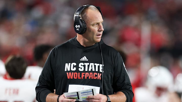 Dec 28, 2023; Orlando, FL, USA;  North Carolina State Wolfpack head coach Dave Doeren looks on from the sidelines during the Pop-Tarts bowl against Kansas State Wildcats in the fourth quarter at Camping World Stadium. Mandatory Credit: Nathan Ray Seebeck-Imagn Images