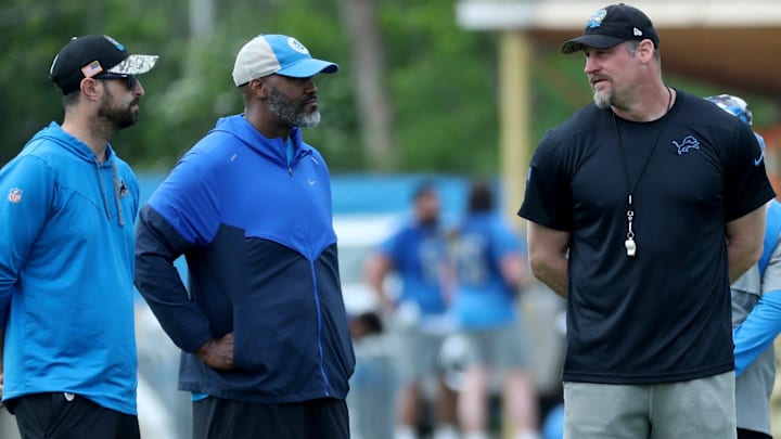 Detroit Lions Chief Operating Officer Mike Disner, GM Brad Holmes and Head Coach Dan Campbell watch drills Detroit Lions Chief Operating Officer Mike Disner, GM Brad Holmes and Head Coach Dan Campbell watch drills