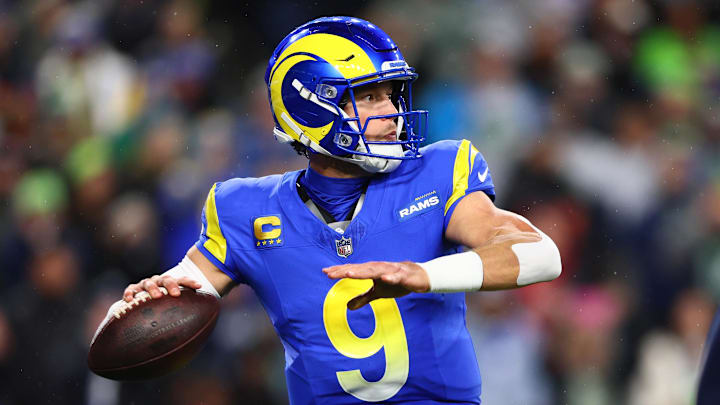 Dec 18, 2025; Seattle, Washington, USA; Los Angeles Rams quarterback Matthew Stafford (9) passes against the Seattle Seahawks in the first half at Lumen Field. Mandatory Credit: Kevin Ng-Imagn Images