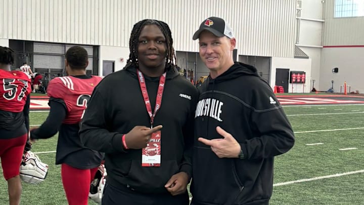 Radcliff (Ky.) North Hardin defensive tackle Josiah Hope and Louisville defensive line coach Mark Hagen