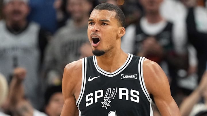 May 12, 2026; San Antonio, Texas, USA; San Antonio Spurs forward Victor Wembanyama and guard Devin Vassell (24) react during the first half of game five of the second round of the 2026 NBA Playoffs against the Minnesota Timberwolves at Frost Bank Center. Mandatory Credit: Scott Wachter-Imagn Images