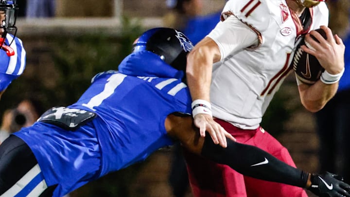 Oct 18, 2024; Durham, North Carolina, USA; Florida State Seminoles quarterback Brock Glenn (11) ruins with the ball but is tackled by Duke Blue Devils safety Terry Moore (1) during the first half of the game at Wallace Wade Stadium. Mandatory Credit: Jaylynn Nash-Imagn Images Oct 18, 2024; Durham, North Carolina, USA; Florida State Seminoles quarterback Brock Glenn (11) ruins with the ball but is tackled by Duke Blue Devils safety Terry Moore (1) during the first half of the game at Wallace Wade Stadium. Mandatory Credit: Jaylynn Nash-Imagn Images
