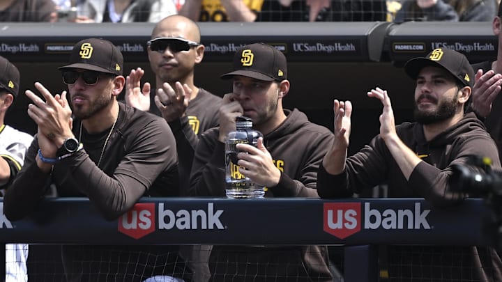 Mar 28, 2024; San Diego, California, USA; San Diego Padres starting pitcher Joe Musgrove (44) looks on alongside starting pitchers Michael King (34) and Dylan Cease (84) during the first inning against the San Francisco Giants at Petco Park. Mandatory Credit: Orlando Ramirez-Imagn Images