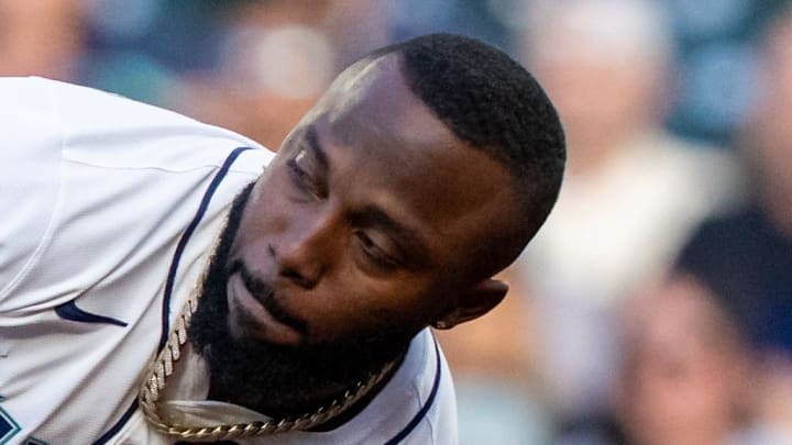Seattle Mariners left fielder Randy Arozarena (56) slips as he attempts to return to first base after hitting a single during the second inning at T-Mobile Park on July 19. 