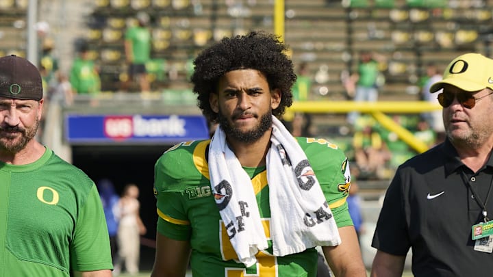 Sep 6, 2025; Eugene, Oregon, USA; Oregon Ducks quarterback Dante Moore (5) walks off the field after a game against the Oklahoma State Cowboys at Autzen Stadium. Mandatory Credit: Troy Wayrynen-Imagn Images