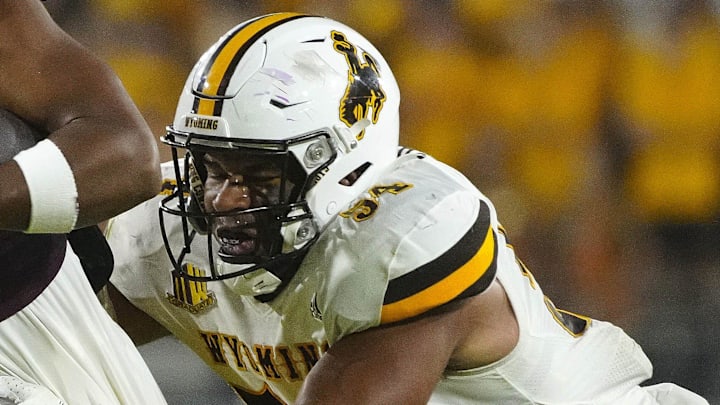 August 31, 2024; Tempe, Ariz.; USA; ASU runningback DeCarlos Brooks (25) runs through a tackle from Wyoming defensive lineman Sabastian Harsh (54) during a game at Sun Devil Stadium.