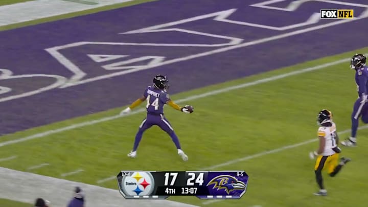 Baltimore Ravens' Marlon Humphrey runs in a pick-6 against the Pittsburgh Steelers on Dec. 21, 2024.