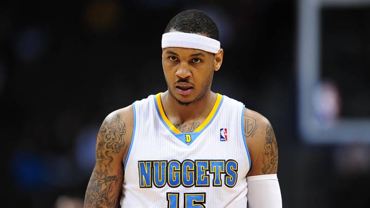 Feb 7, 2011; Denver, CO, USA; Denver Nuggets small forward Carmelo Anthony (15) reacts with 5.3 seconds left in the fourth quarter against the Houston Rockets at the Pepsi Center. The Rockets defeated the Nuggets 108-103. Mandatory Credit: Ron Chenoy-Imagn Images