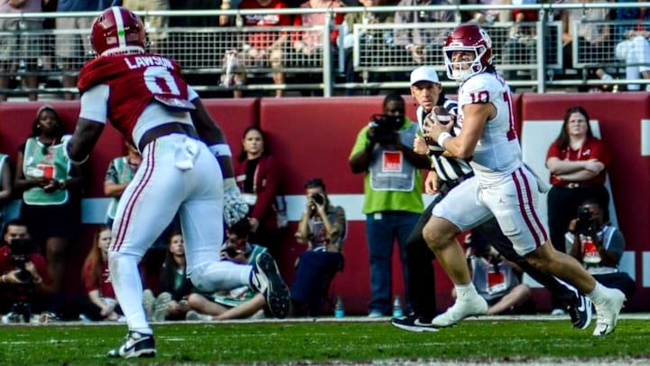 Oklahoma quarterback John Mateer rolls out to his right against Alabama. Oklahoma quarterback John Mateer rolls out to his right against Alabama.