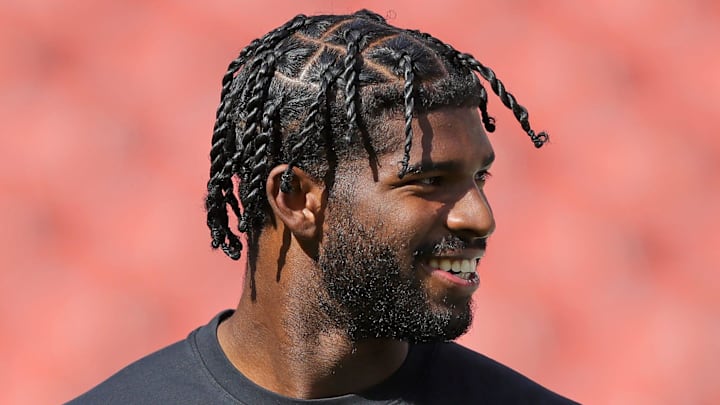 Cleveland Browns quarterback Shedeur Sanders is all smiles as he warms up before an NFL football game at Huntington Bank Field, Sept. 21, 2025, in Cleveland, Ohio.