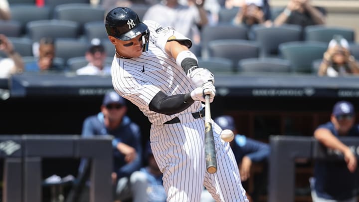 May 3, 2025; Bronx, New York, USA; New York Yankees right fielder Aaron Judge (99) hits a solo home run in the first inning against the Tampa Bay Rays at Yankee Stadium. May 3, 2025; Bronx, New York, USA; New York Yankees right fielder Aaron Judge (99) hits a solo home run in the first inning against the Tampa Bay Rays at Yankee Stadium.
