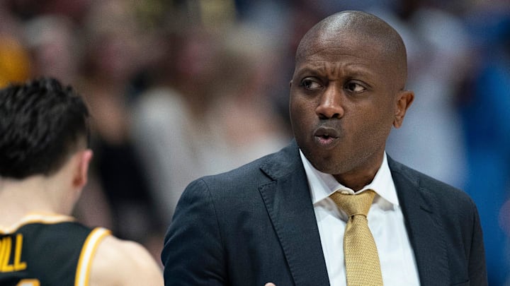 Missouri head coach Dennis Gates calms down his team against Florida during the first half of their quarterfinal game of the SEC Men's Basketball Tournament at Bridgestone Arena in Nashville, Tenn., Friday, March 14, 2025.