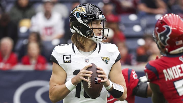 Nov 26, 2023; Houston, Texas, USA; Jacksonville Jaguars quarterback Trevor Lawrence (16) looks for an open receiver during the first quarter against the Houston Texans at NRG Stadium. Mandatory Credit: Troy Taormina-Imagn Images