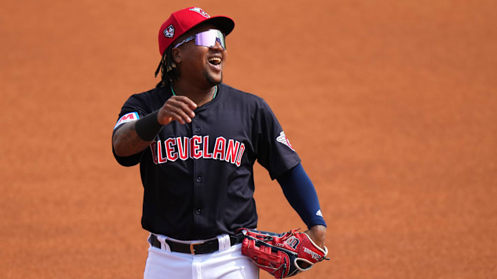 Cleveland Guardians third baseman Jose Ramirez (11) smiles as he takes the field in the first inning during a MLB spring training baseball game against the Cincinnati Reds, Saturday, Feb. 24, 2024, at Goodyear Ballpark in Goodyear, Ariz.