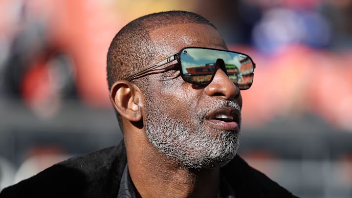 Dec 21, 2025; Cleveland, Ohio, USA;  Legendary  football and baseball player and father of Cleveland Browns quarterback Shedeur Sanders, Deion Sanders on the sidelines prior to a game against the Buffalo Bills at Huntington Bank Field. 