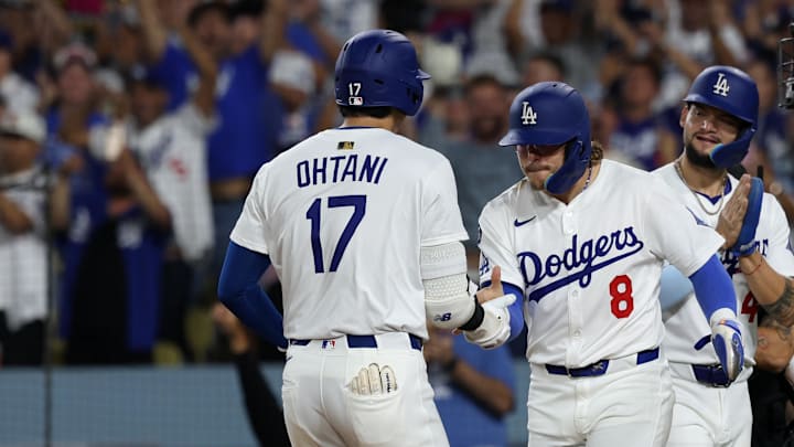 Los Angeles Dodgers designated hitter Shohei Ohtani (17) is greeted by third baseman Enrique Hernandez (8) after hitting a three-run home run during the fifth inning against the San Francisco Giants at Dodger Stadium on Sept. 19. Los Angeles Dodgers designated hitter Shohei Ohtani (17) is greeted by third baseman Enrique Hernandez (8) after hitting a three-run home run during the fifth inning against the San Francisco Giants at Dodger Stadium on Sept. 19.
