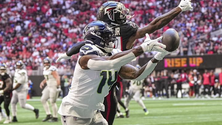 Oct 20, 2024; Atlanta, Georgia, USA; Seattle Seahawks wide receiver DK Metcalf (14) can not make a catch in the end zone defended by Atlanta Falcons cornerback A.J. Terrell (24) during the first quarter at Mercedes-Benz Stadium. Mandatory Credit: Dale Zanine-Imagn Images