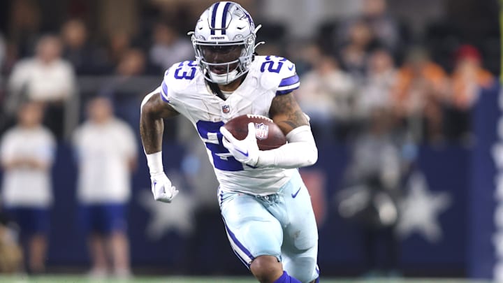 Dec 22, 2024; Arlington, Texas, USA; Dallas Cowboys running back Rico Dowdle (23) runs the ball against the Tampa Bay Buccaneers in the second half at AT&T Stadium. Mandatory Credit: Tim Heitman-Imagn Images