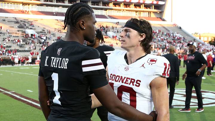 Mississippi State Bulldogs quarterback Kamario Taylor (1) and Oklahoma Sooners quarterback John Mateer (10) talk after the game at Davis Wade Stadium at Scott Field. 