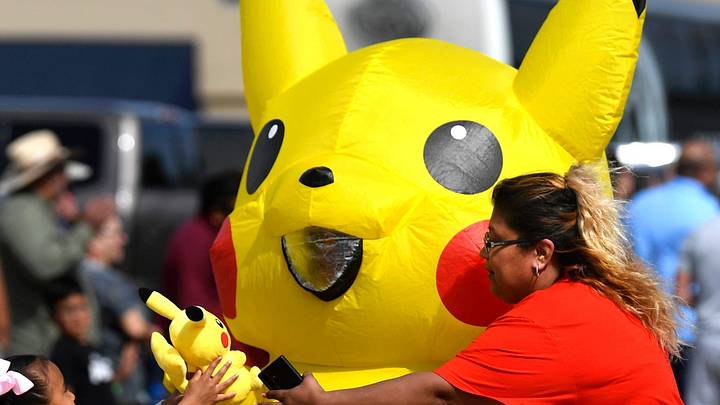 Five-year-old Briana shows her Pikachu doll to a life-sized version of the Pokemon character as it marches down Randolph Street during the San Angelo Rodeo Parade Saturday April 6, 2024 in Abilene, Texas. Five-year-old Briana shows her Pikachu doll to a life-sized version of the Pokemon character as it marches down Randolph Street during the San Angelo Rodeo Parade Saturday April 6, 2024 in Abilene, Texas.