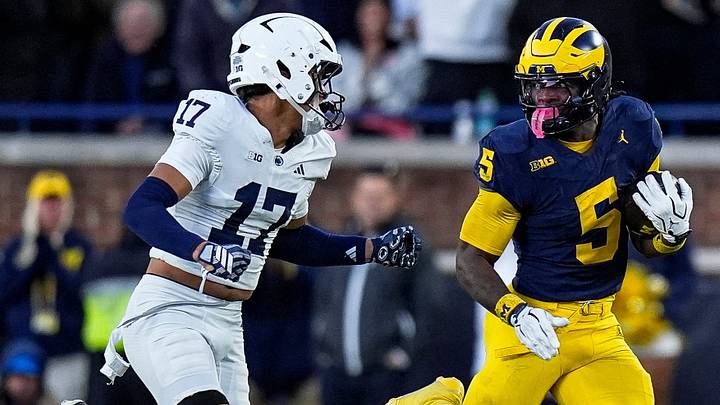 Michigan running back Savion Hiter (5) runs against Penn State cornerback Josiah Zayas (17)