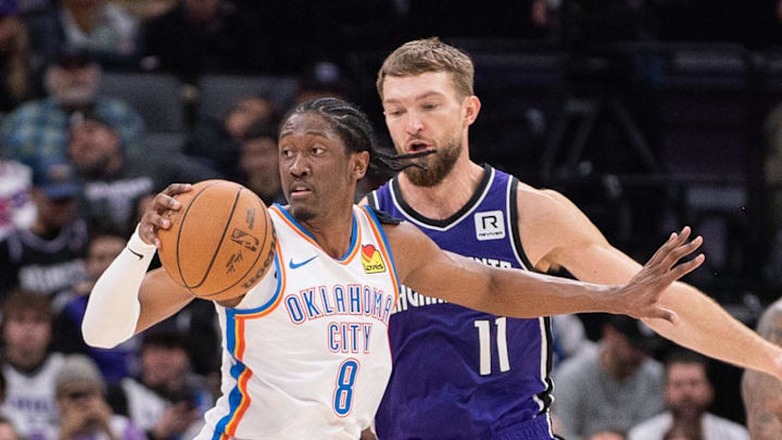 Sacramento Kings forward Domantas Sabonis (11) defends against Oklahoma City Thunder forward Jalen Williams (8) during the second quarter at Golden 1 Center.